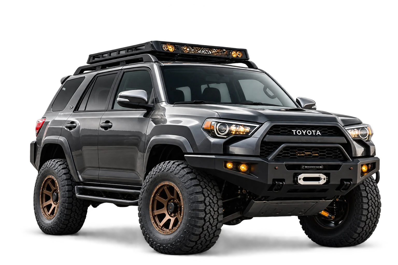 The finished 4Runner build with lift, bronze wheels, bumper, roof rack and lights.